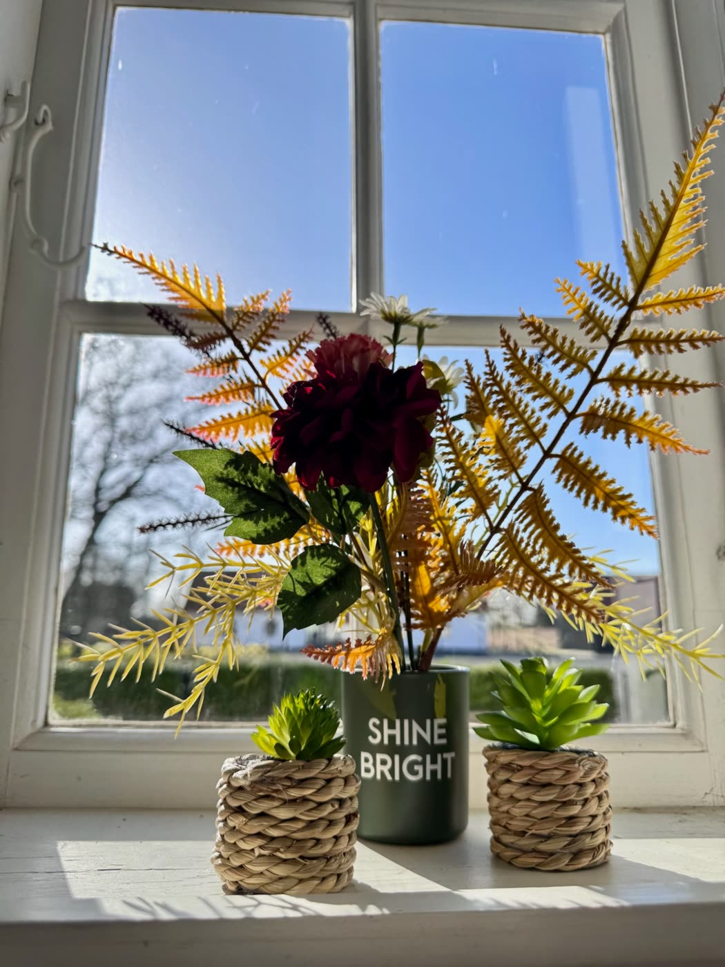 Blomster i vindueskarmen
